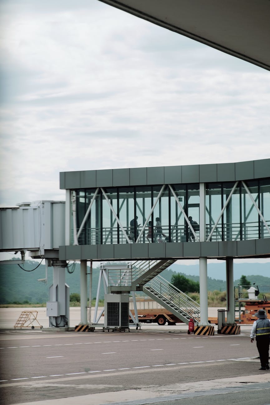 View of a modern jet bridge at an airport, ideal for travel and transportation themes.