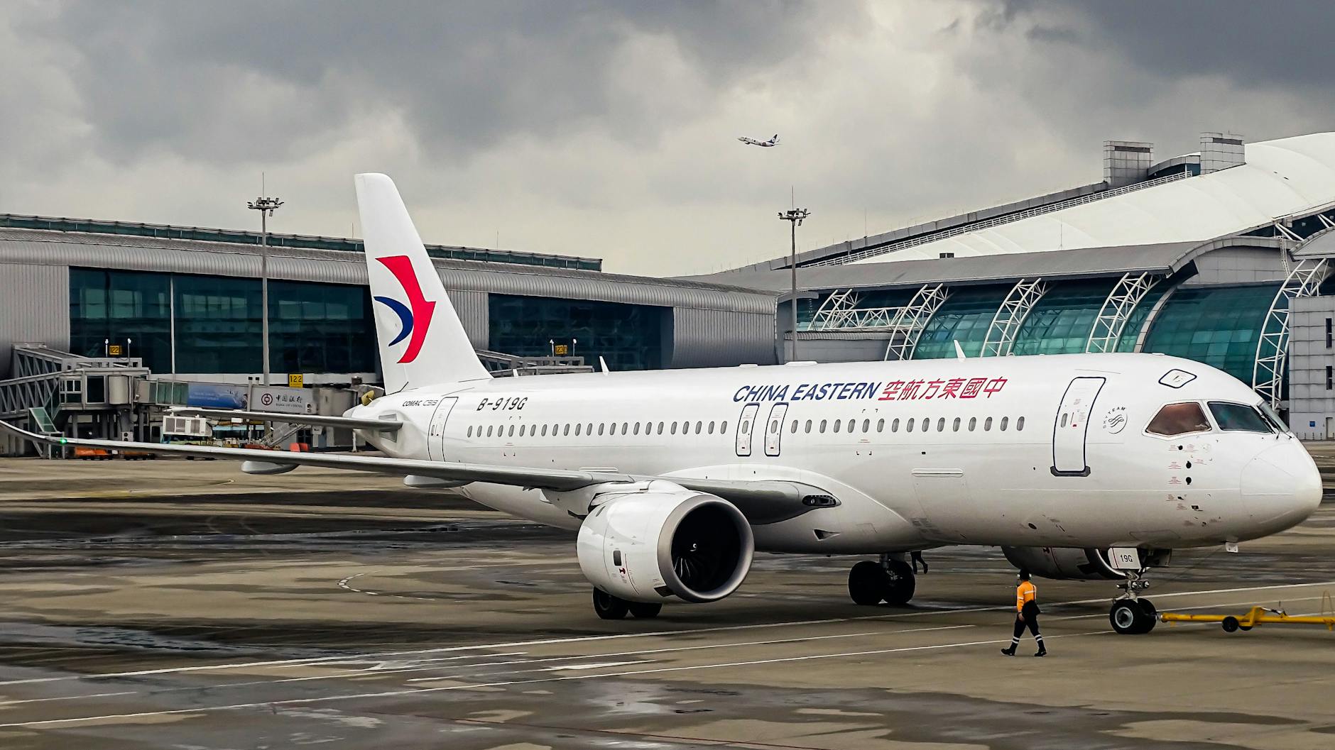 China Eastern Airlines aircraft parked at an airport terminal, ready for its next journey.