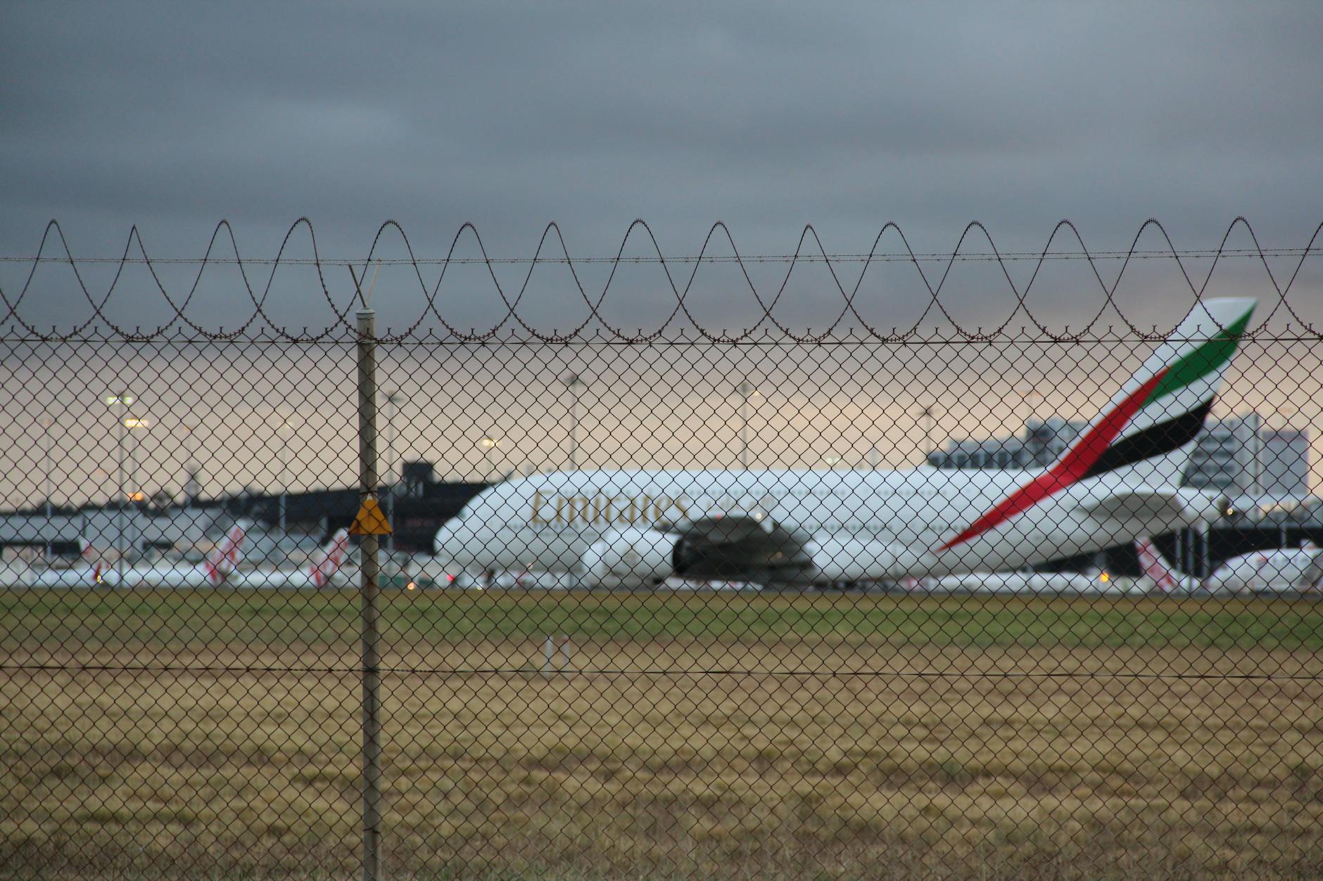 Emirates A380 at Melbourne Airport with dramatic sky backdrop