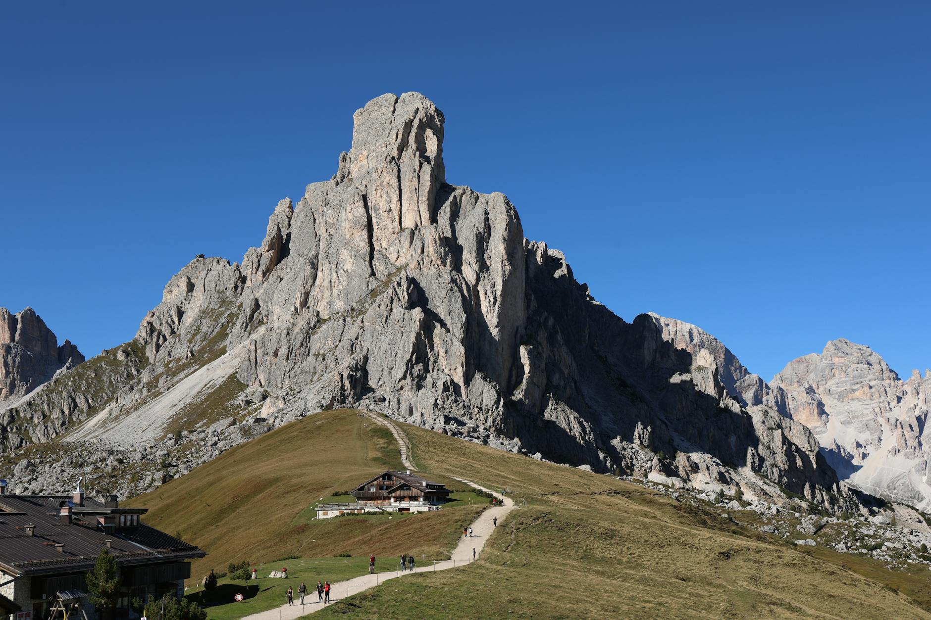 Breathtaking view of Giau Pass, Dolomites in Veneto, Italy with clear blue sky.