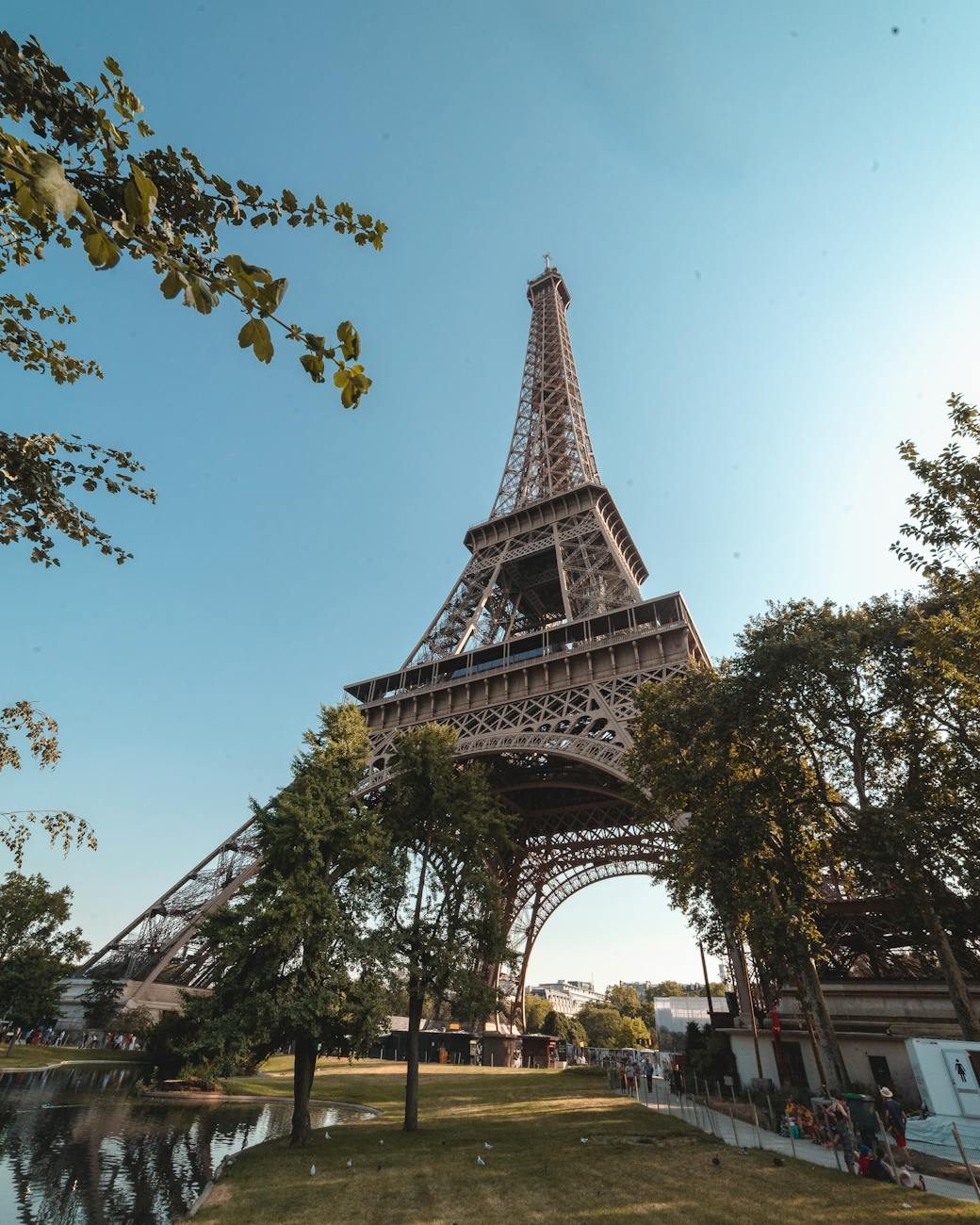 Iconic view of the Eiffel Tower, Paris under a blue sky, ideal for travel inspiration.