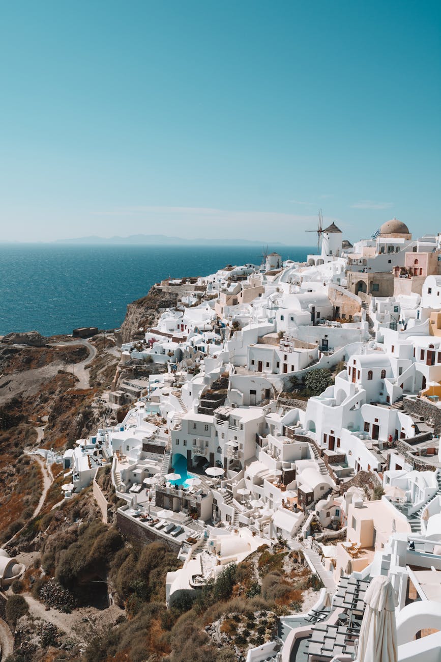 Explore Santorini's stunning white buildings against the azure sea, a perfect travel destination.