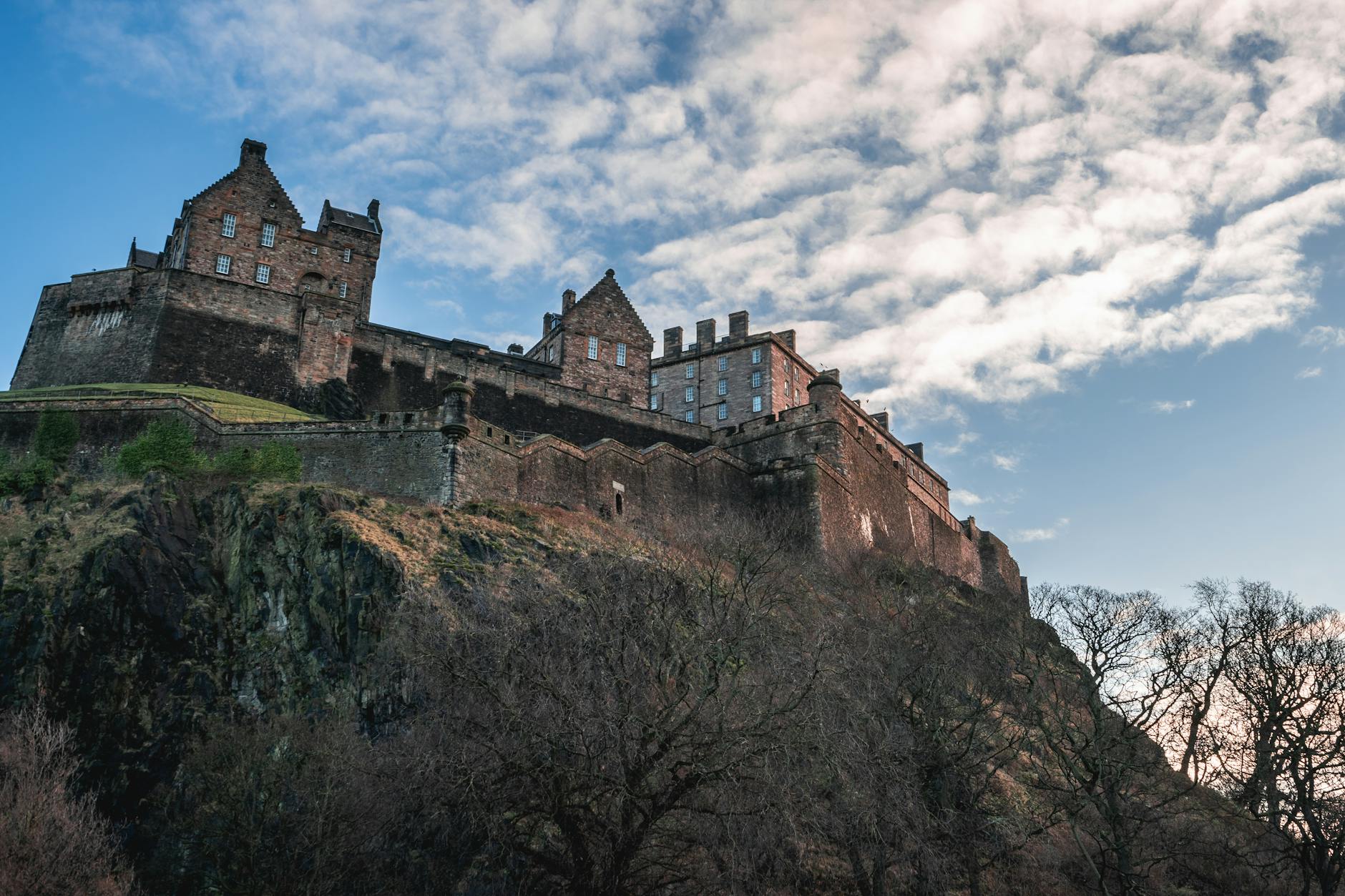 Stunning view of Edinburgh Castle, Scotland, under a clear blue sky.