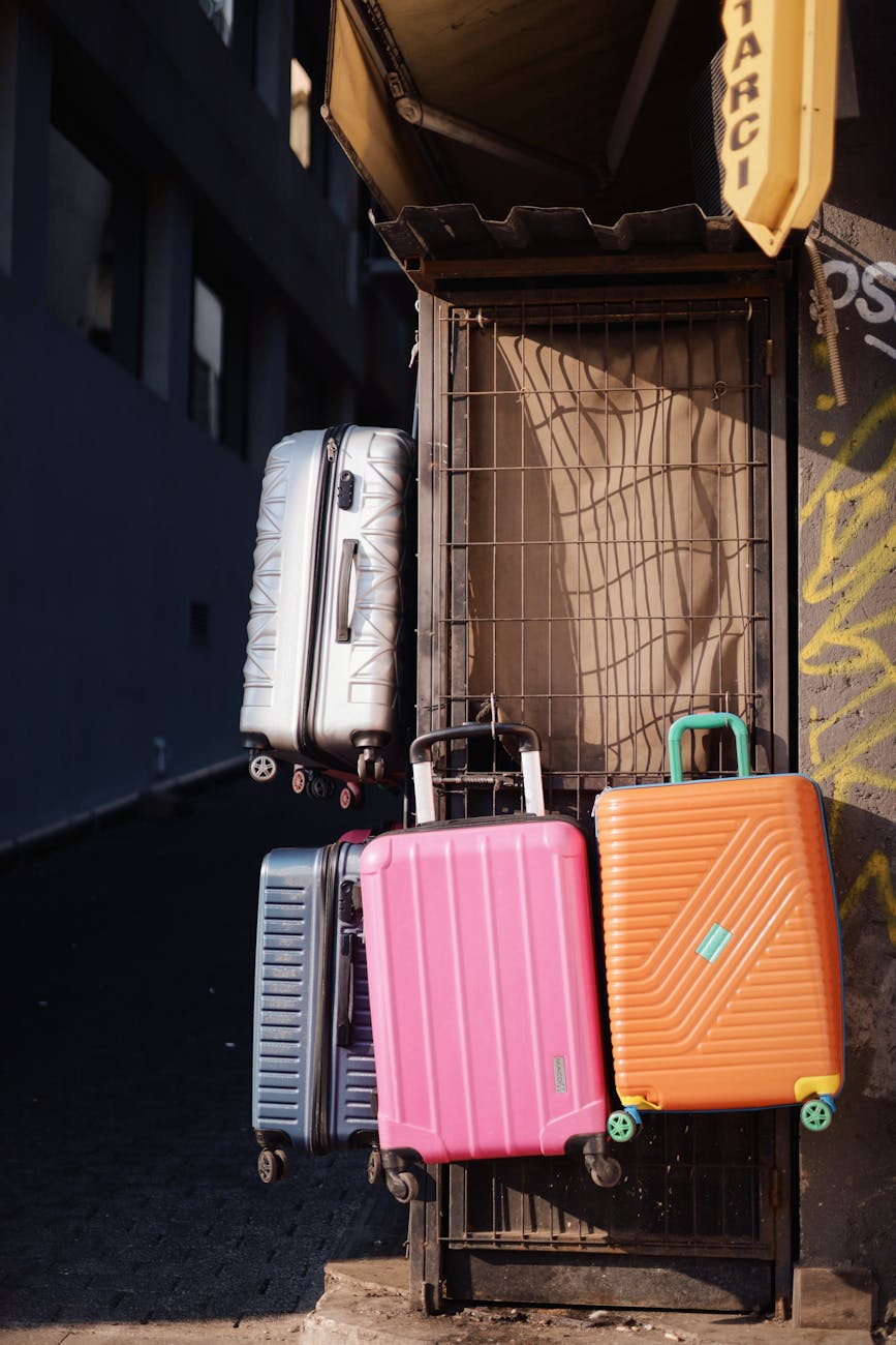 Vibrant suitcases stacked against a wall in an Istanbul street scene.