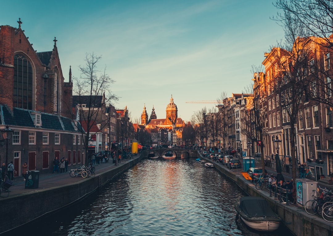 boat on river across building